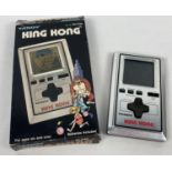 A boxed 1982 Tandy King Kong handheld LCD video game. Interior packaging missing.