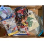 A collection of assorted Lego pieces and play sets. To include bagged Lego Creator pieces with