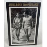 A sealed box set of James Bond 007 50th Anniversary 100 postcards from DK.