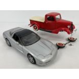 An unboxed UT Models 1998 1:18 scale silver Chevrolet Corvette. Together with an unboxed 1:18