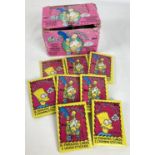 A box containing 18 packets of The Simpsons cards, from Topps, 1990. Each containing 16 cards and