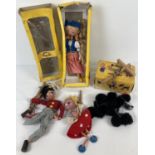 2 boxed vintage Pelham puppets. A Dutch girl and a black poodle. Together with 2 other Pelham