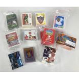 A collection of sets of Football trading cards and card games. To include: Arsenal 1999 Futera