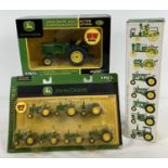A blister pack John Deere Styled Letter set of diecast tractors and a boxed John Deere 1:32 scale