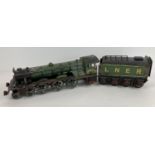A vintage tin plate model train "The Flying Scotsman" together with an LNER tender. Train approx.