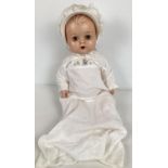 A vintage 1960's Kader 20" hard plastic, made in Hong Kong, baby doll. With moving eyes and