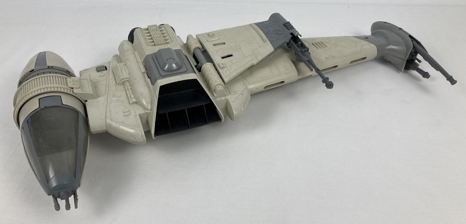 A vintage 1984 "Return Of The Jedi" B Wing fighter with collapsible wings, one removable gun and