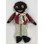 An early 20th century hand made Golly toy with original clothing and real fur hair. Approx. 38cm
