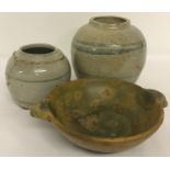 3 pieces of Eastern stoneware ceramics. 2 bulbous jars with blue stripe detail together with a 2