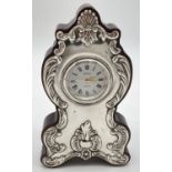 A dark wood cased silver fronted decorative quartz mantel clock by R. Carr. Of classical design,