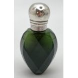 A Victorian green glass faceted scent bottle with hallmarked silver lid. Hinge lidded bottle,