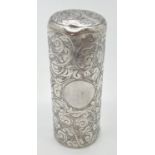 A Victorian silver hinge lidded canister with ornate scroll and foliate engraved decoration.