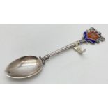 A vintage silver teaspoon with enamelled handle featuring the coats of arms for Norwich. Fully