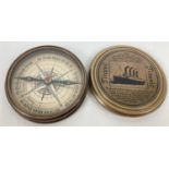 A brass cased compass with screw top lid featuring the Titanic. Picture and writing detail inside