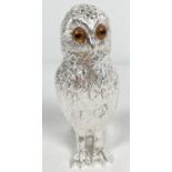 A modern heavy silver plated sugar sifter modelled as an owl. With push top lid, amber coloured