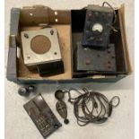 A box containing a collection of vintage Morse code equipment. To include a YA 2488 WWII ear