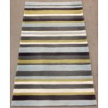 A modern 'Think Rugs' acrylic striped rug in grey, pale blue, cream & lime green colours. 90cm x