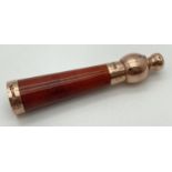 A vintage cheroot holder with 9ct rose gold mount and bulbous designed mouthpiece. Hallmarked for