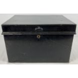 A small vintage black metal deed box with carry handles and brass lock. Approx. 39 5 x 27.5 x 24.