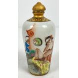 A small Chinese ceramic snuff bottle with painted erotic scene. Gilt painted stopper and top rim.