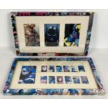 2 comic book pictures depicting Batman and The Avengers with decoupage decorated picture frames.