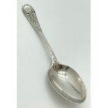 A decorative Victorian Richard Martin & Ebenezer Hall silver spoon. With ornate detail to handle and