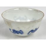 A small Chinese porcelain tea bowl with hand painted blue fu bat design to outer bowl. Blue ring and