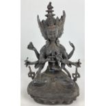 An Oriental hollow bronze figure of Buddhist Deity Marichi, with 3 faces and 8 arms. Set with