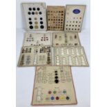 A collection of 8 vintage salesman's sample cards of vintage buttons. In varying sizes and designs
