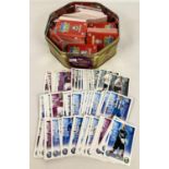A tin of assorted Topps Match Attax Premier League football trading cards.