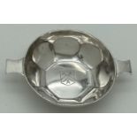 A silver 2 handled quaich engraved with The Carpenters' Company coat of arms. Fully hallmarked for