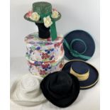 2 modern hat boxes containing a collection of vintage 1980's summer and occasion hats.