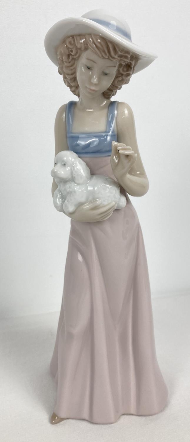 A retired Nao Spanish ceramic figurine "Pampered Poodle", 1991. Approx. 25cm tall.