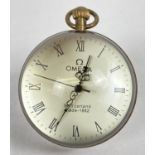 A brass bound, desk top glass ball watch with Roman Numeral markers and top winder. Approx. 6cm