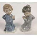 2 Nao Spanish ceramic figurines of a boy and girl praying. 1985, tallest approx. 13.5cm tall.
