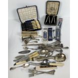 A box of assorted vintage cutlery, to include A1 plate and boxed items. Lot includes: knife rests,