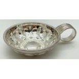 A French silver wine tasting cup with circular decoration to bowl and ridged detail to curled