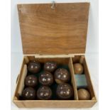 A set of Italian "Bocche" wooden bowls with inlay detail, in a handmade storage box.