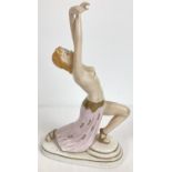 An Austrian Wien porcelain semi nude figurine of a dancer in an Art Deco style. With gilt detailing.