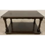 A vintage dark wood heavy coffee table with undershelf and turned detail to legs. Approx. 41cm