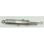 An antique silver propelling pencil and button hook. Floral engraving throughout with empty