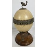 An antique lidded trinket pot made from an ostrich egg. With silver plated interior, decorative