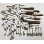A quantity of vintage cutlery and collectable items. To include: carving sets in wooden sheaths,