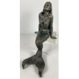 A large cast metal figurine of a mermaid in a seated position. Ideal pond ornament. Approx. 42cm