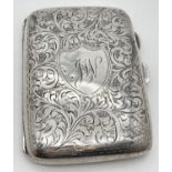 A small Art Deco silver cigarette case engraved to both sides with ornate foliate design. Front