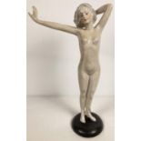 An Austrian Wien porcelain nude figurine on a black circular base. Hand painted detail to hair and