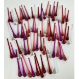 A collection of coloured glass drops, in reds, pinks and clear glass. Longest approx. 14.5cm.