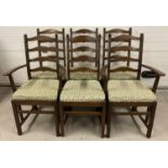 A set of 6 Ercol ladderback dining chairs, to include 2 carvers. All with matching green leaf seat