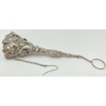 A 19th century German silver tussie-mussie posy holder complete with chain, pin and finger ring.