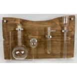 A rustic effect wall hanging display made from vintage glass scientific tubes & flasks. Approx. 21cm